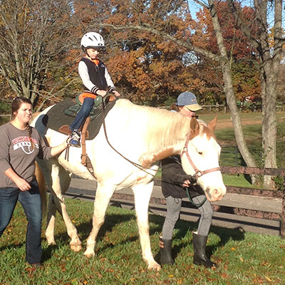 Student riding a horse